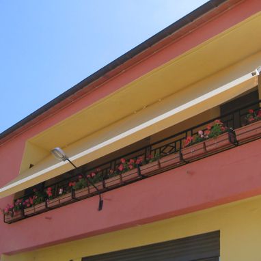 Toldos Irisarri parasol en balcón 